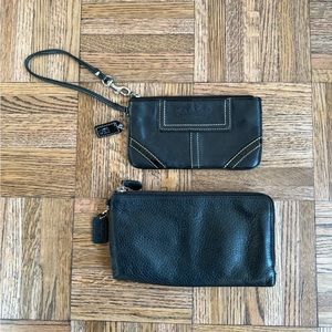 two small black leather coach wristlets